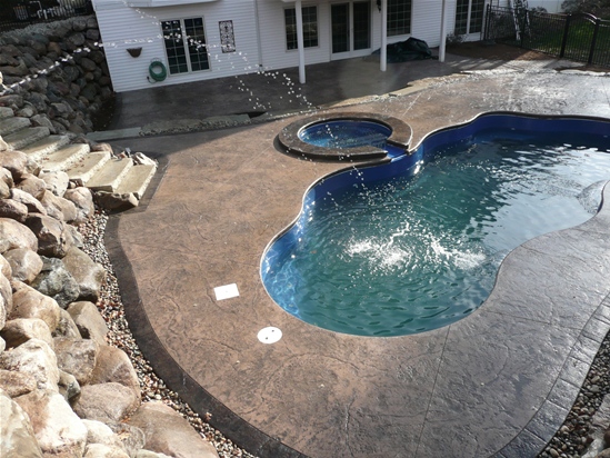 Viking Fiberglass Pools - Laguna and spillover spa installed in Brighton Michigan.