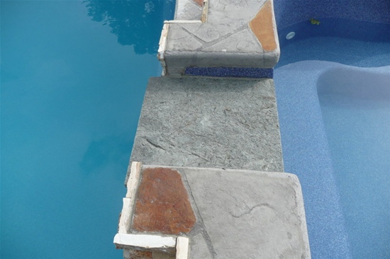 Stamped concrete around fiberglass pool Clarkston MI