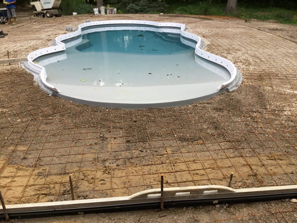 Stamped concrete cantilever on a Thursday Fiberglass Pool. 48381