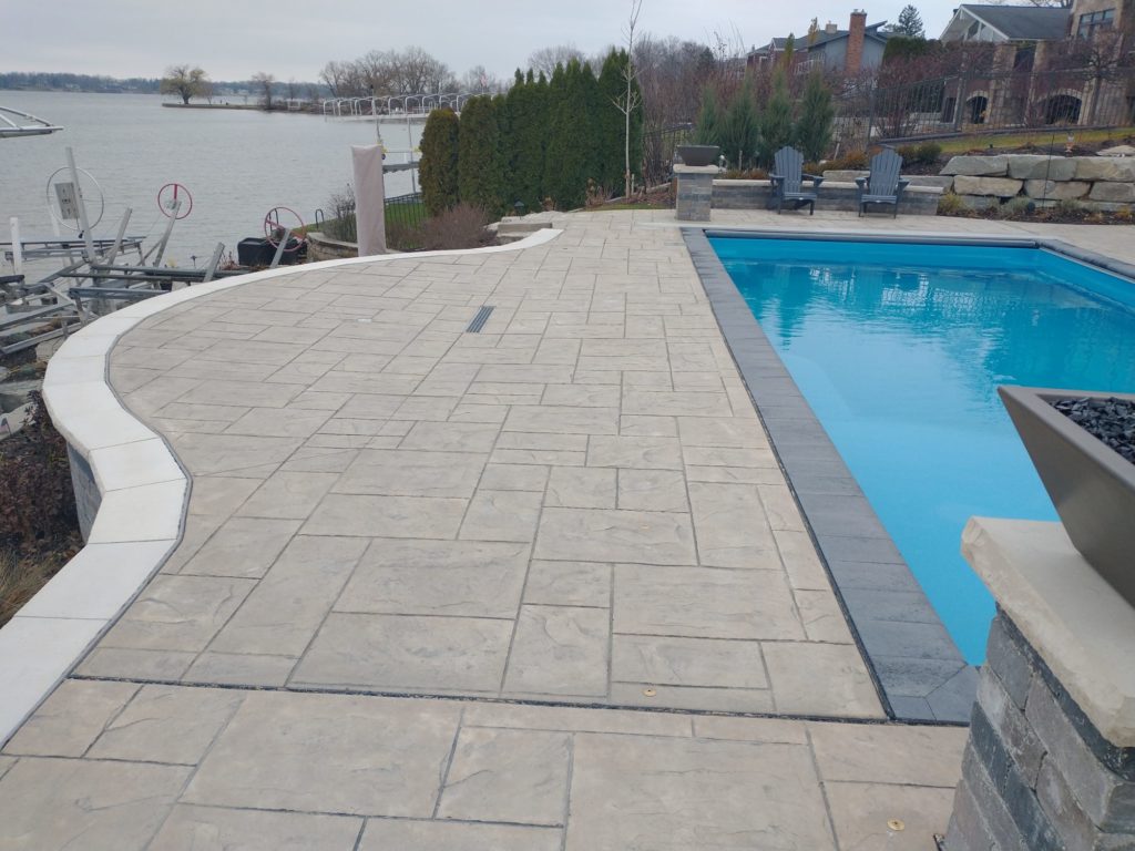 Thursday fiberglass pool with stamped concrete 48301