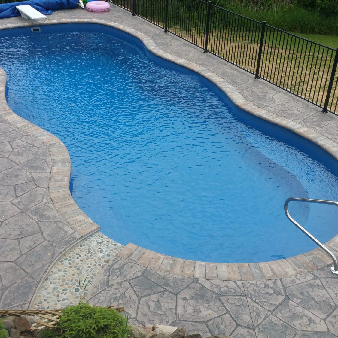 Inground fiberglass pool with Stamped concrete Highland Michigan
